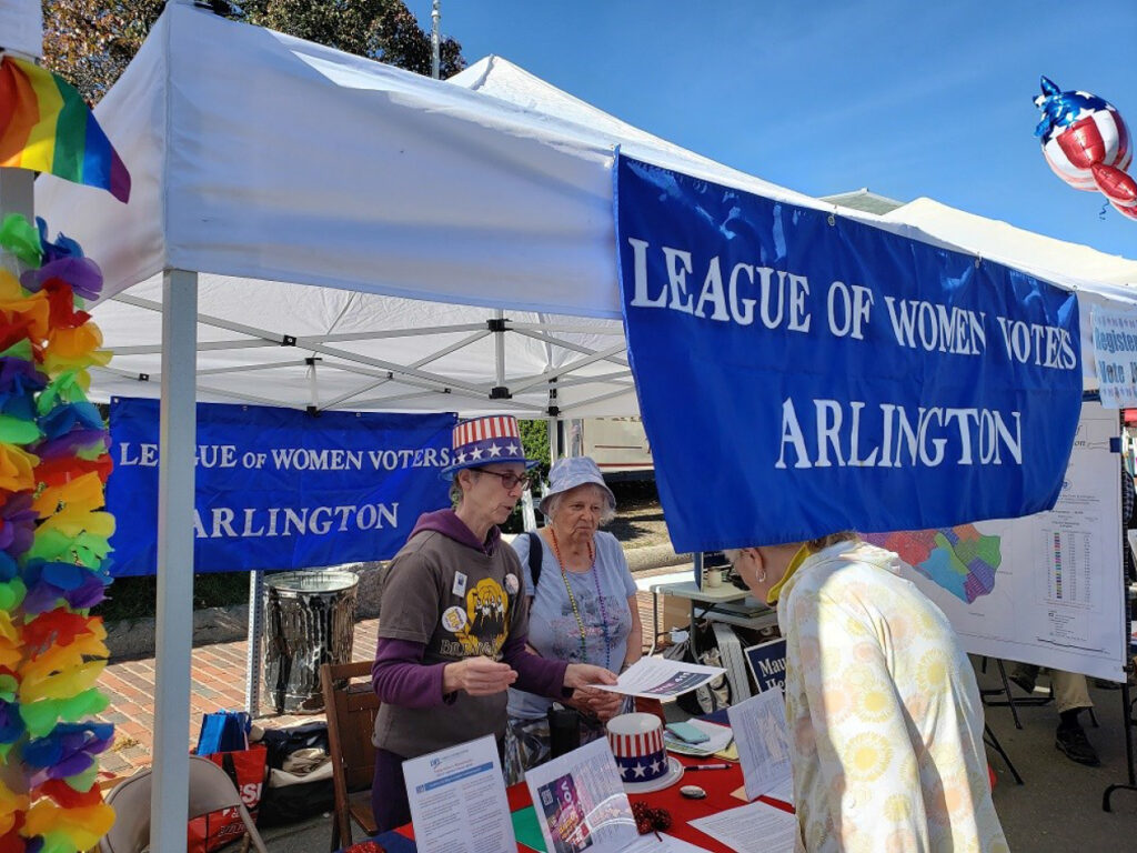 Photo of Patti Muldoon and Liz Blumenthal providing information on Vote411.org to a local voter.