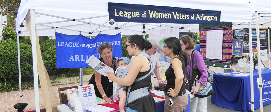 Photo of staff and visitors at League of Women Voters of Arlington booth at Town Day.